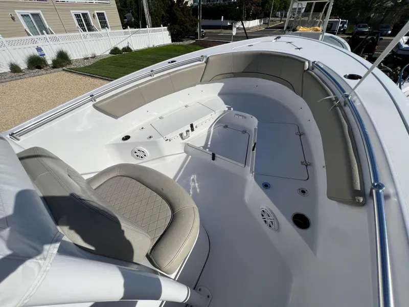Slide: The Image of 2021 Sportsman Heritage 231 Center Console boat interior with seating and storage compartments. - 27
