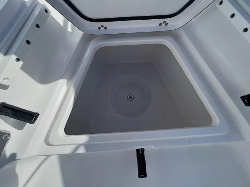 Slide: The Image of 2021 Sportsman Heritage 231 Center Console storage compartment, open and empty. - 28