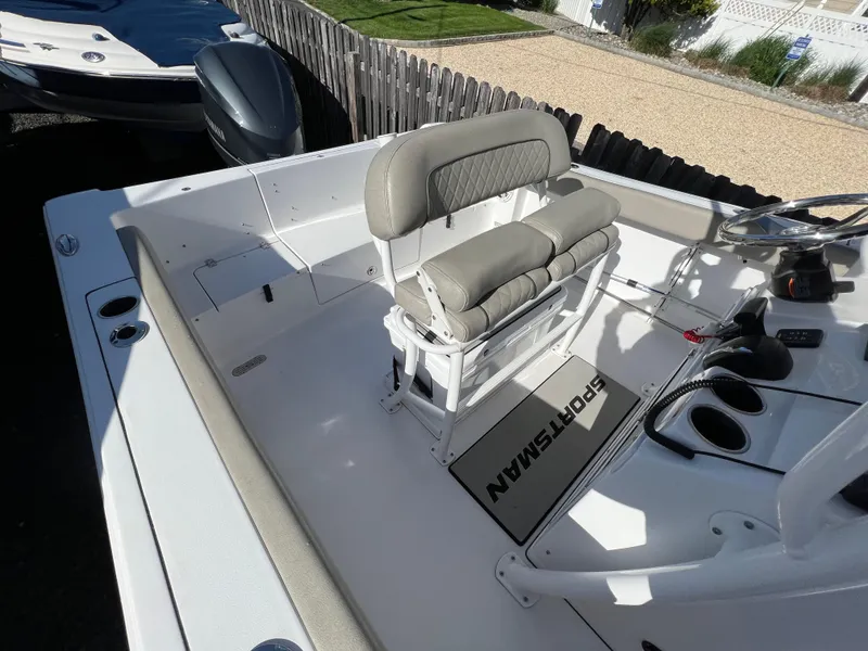 Slide: The Image of 2021 Sportsman Heritage 231 Center Console boat interior with seating and controls. - 29