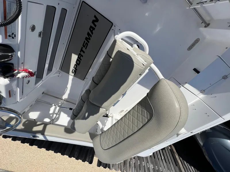 Slide: The Image of 2021 Sportsman Heritage 231 Center Console boat interior with cushioned seating. - 31