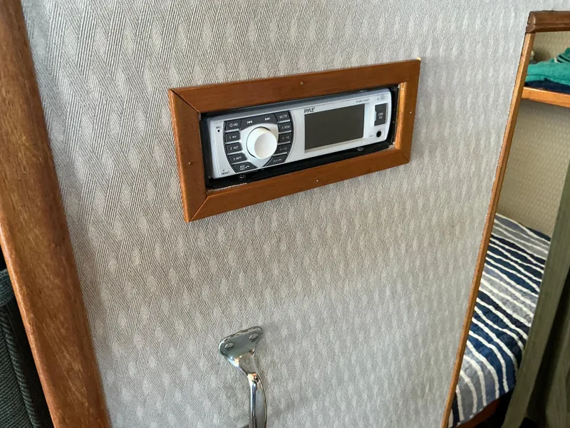 Slide: The Image of 1978 Californian 34 LRC interior with built-in stereo system and wood trim. - 13