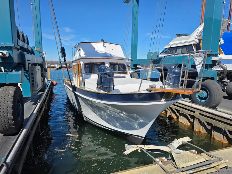 Slide: The Image of 1978 Californian 34 LRC boat docked at marina under clear blue sky. - 2