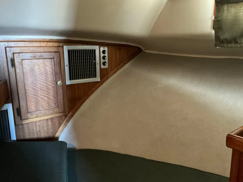 Slide: The Image of 1978 Californian 34 LRC cabin interior with wood paneling and vent. - 23
