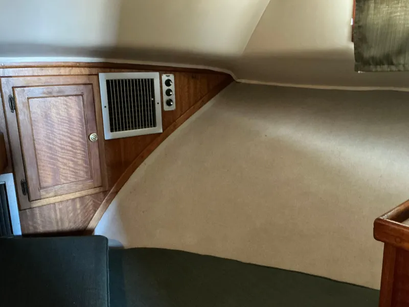 Slide: The Image of 1978 Californian 34 LRC cabin interior with wood paneling and ventilation. - 24