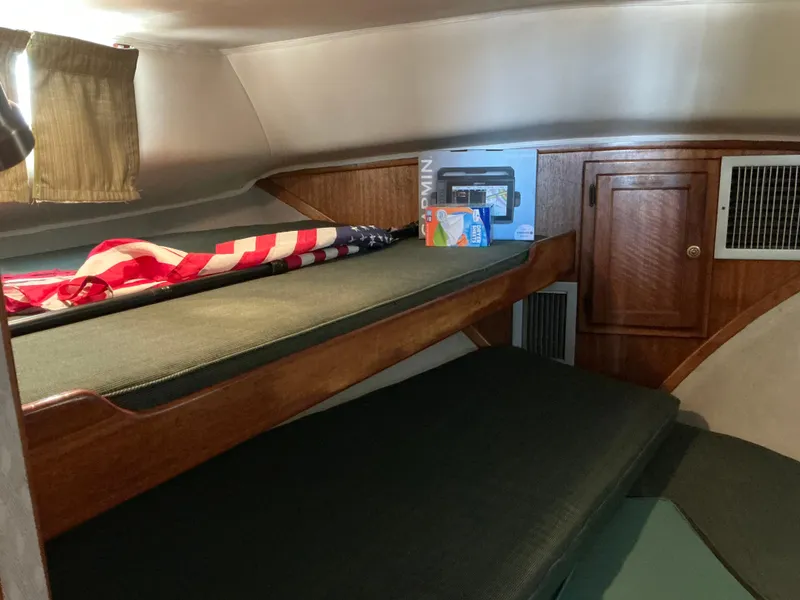 Slide: The Image of 1978 Californian 34 LRC cabin interior with bunk beds and wooden cabinetry. - 25