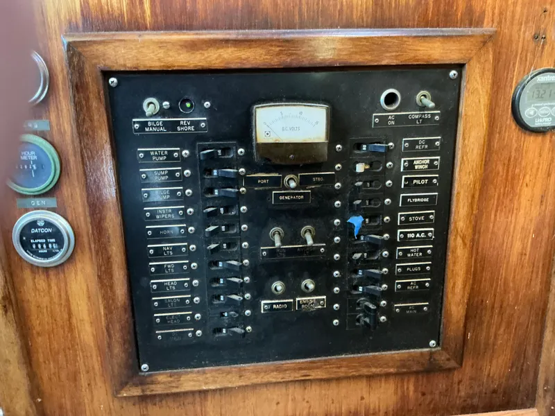 Slide: The Image of Electrical control panel on a 1978 Californian 34 LRC boat, featuring switches and gauges. - 29