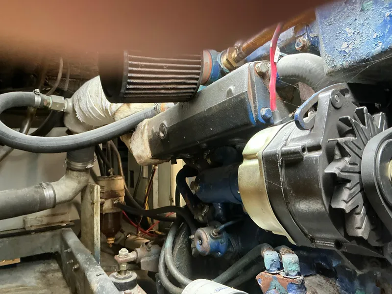 Slide: The Image of Engine compartment of a 1978 Californian 34 LRC boat, showing mechanical components and hoses. - 36