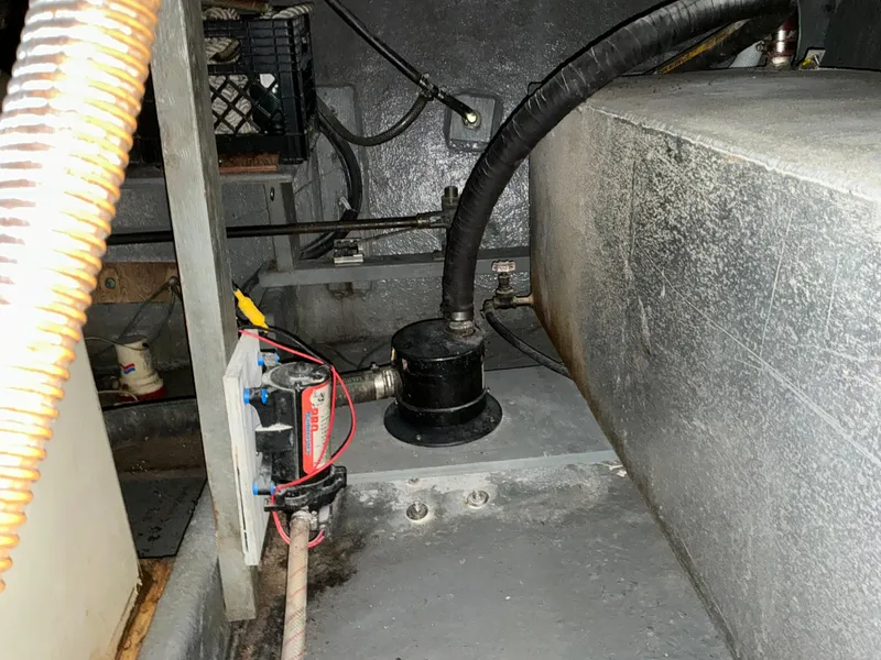 Slide: The Image of 1978 Californian 34 LRC engine compartment with hoses and electrical components. - 38