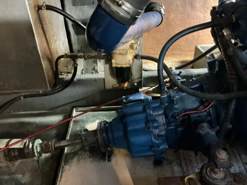 Slide: The Image of Engine compartment of a 1978 Californian 34 LRC boat, showing mechanical components and wiring. - 41