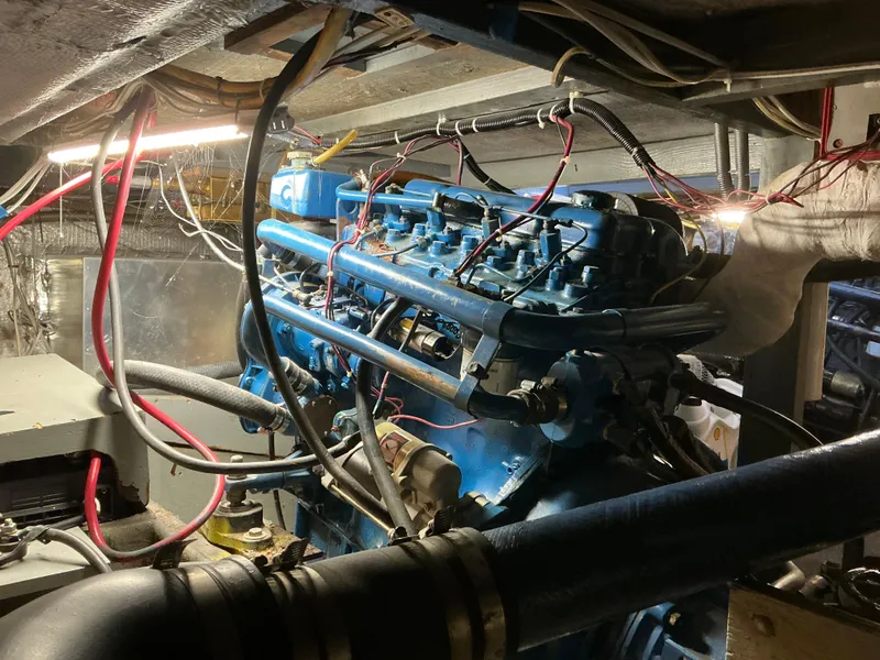 Slide: The Image of Engine room of a 1978 Californian 34 LRC boat, showcasing complex wiring and machinery. - 42