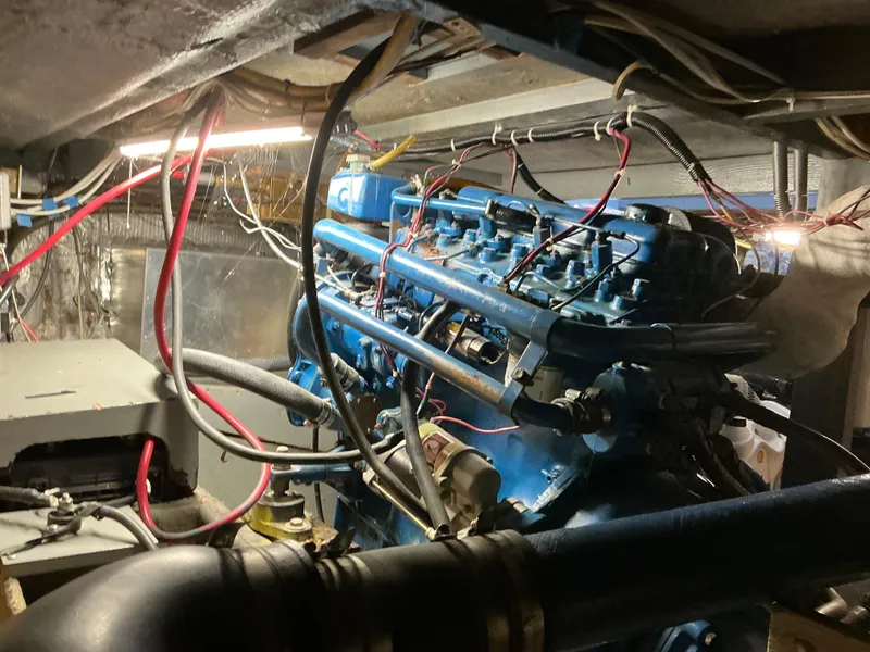 Slide: The Image of 1978 Californian 34 LRC engine compartment with visible wiring and blue engine components. - 43