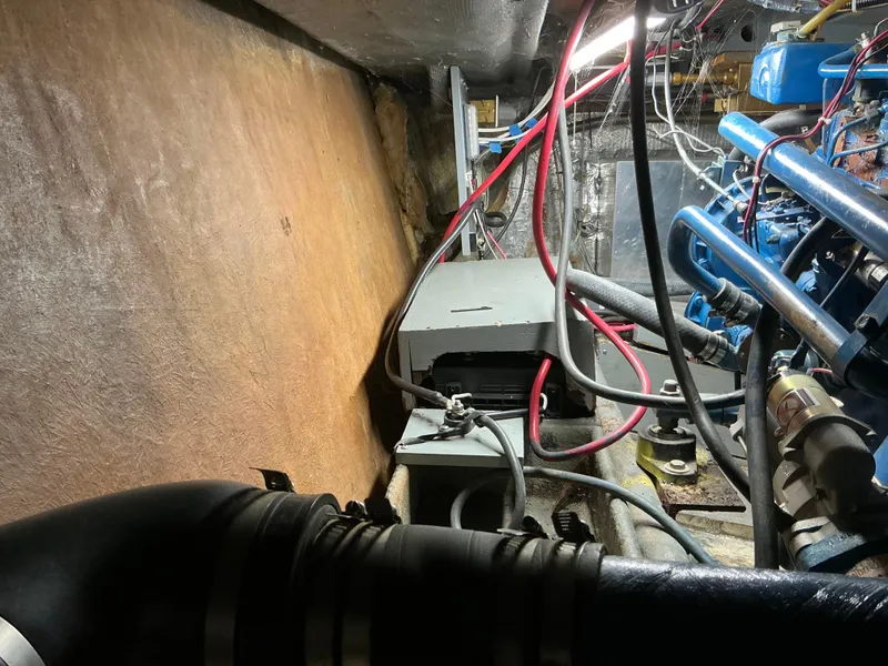 Slide: The Image of Engine compartment of a 1978 Californian 34 LRC boat with visible wiring and components. - 44