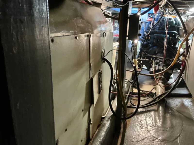 Slide: The Image of Engine room of 1978 Californian 34 LRC boat with visible wiring and machinery. - 47