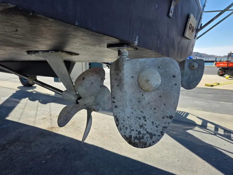 Slide: The Image of 1978 Californian 34 LRC boat propeller and rudder detail in a shipyard. - 5