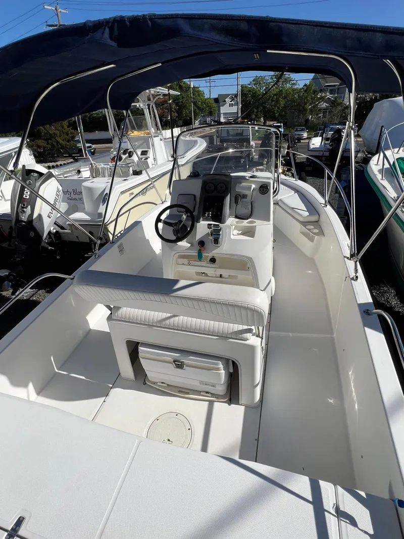 Slide: The Image of 2008 Boston Whaler 210 Dauntless boat with canopy and center console. - 6