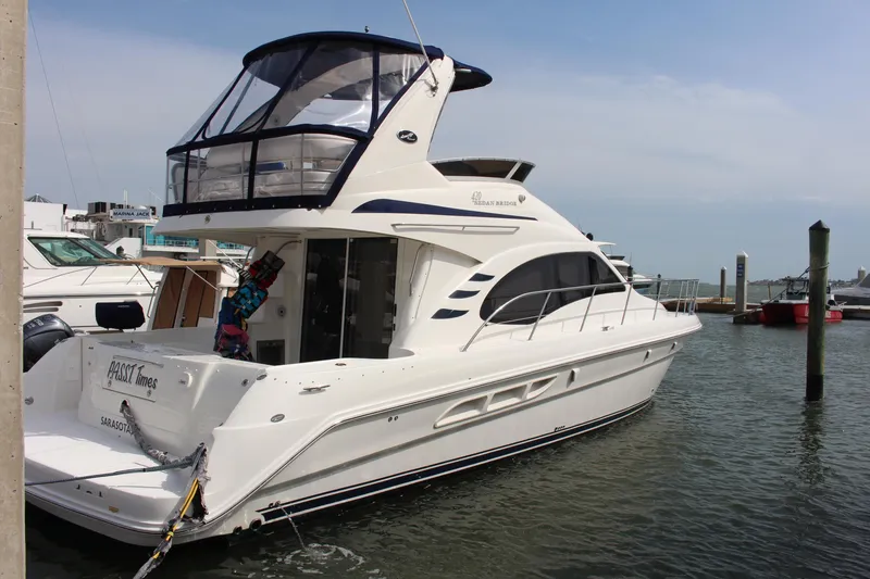 Slide: The Image of 2005 Sea Ray 420 Sedan Bridge yacht docked in marina. - 1