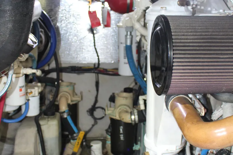 Slide: The Image of Engine room of a 2005 Sea Ray 420 Sedan Bridge with visible components and wiring. - 29