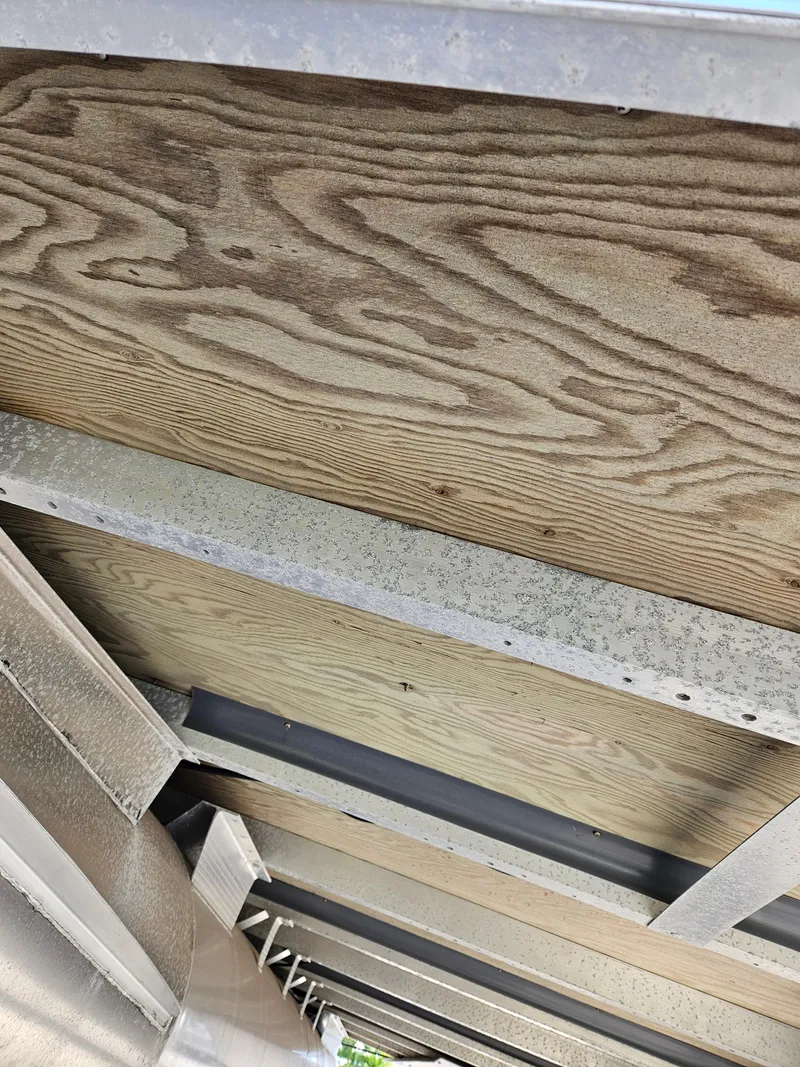 Slide: The Image of Underside view of 2019 Bennington 20 SX boat with wooden and metal framework. - 22