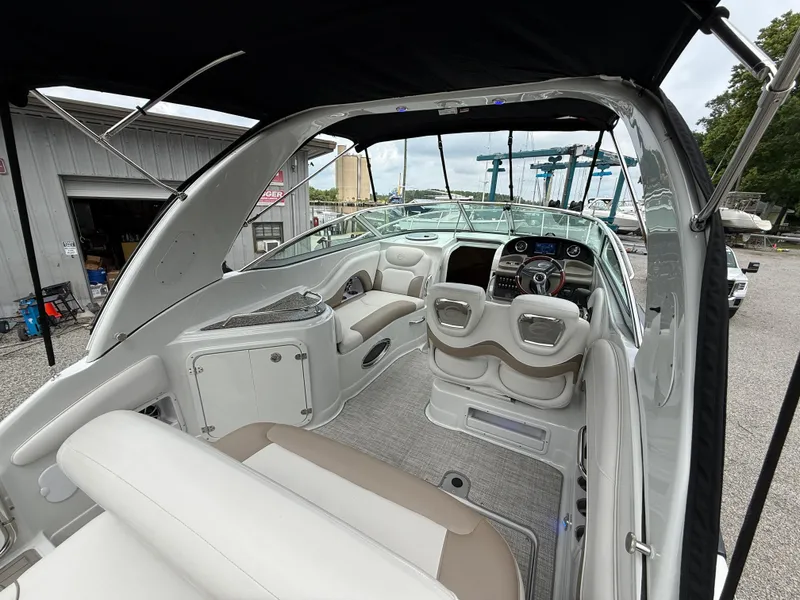 Slide: The Image of 2023 Crownline 270 CR boat interior with seating and dashboard view. - 10