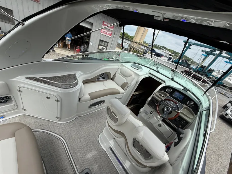 Slide: The Image of 2023 Crownline 270 CR boat interior with modern helm and seating. - 8