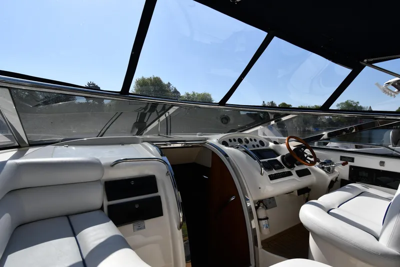 Slide: The Image of Interior view of 1996 Sunseeker Camargue 51 yacht cockpit with luxurious seating and controls. - 13
