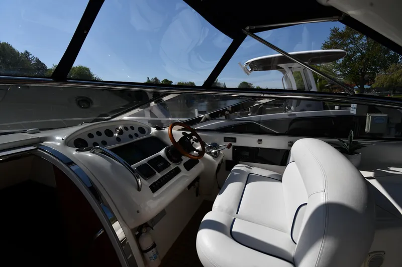 Slide: The Image of Interior view of 1996 Sunseeker Camargue 51 yacht cockpit with steering wheel and controls. - 14