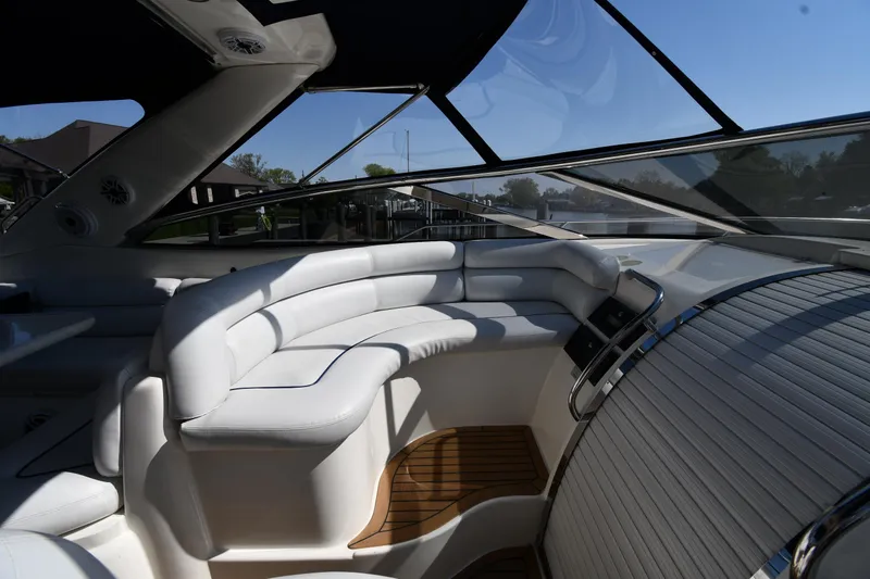 Slide: The Image of Interior of 1996 Sunseeker Camargue 51 yacht with white seating and wooden flooring. - 22