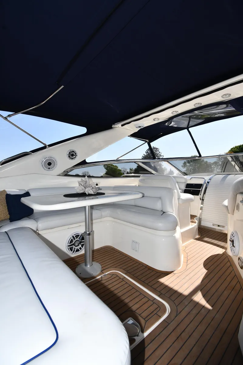 Slide: The Image of 1996 Sunseeker Camargue 51 yacht interior with white seating and wooden flooring. - 27