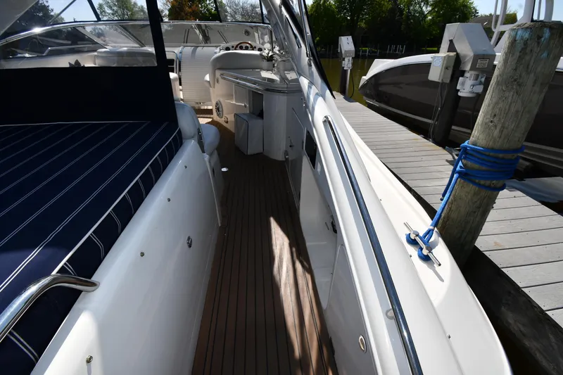Slide: The Image of 1996 Sunseeker Camargue 51 yacht docked, featuring sleek deck and modern design. - 32