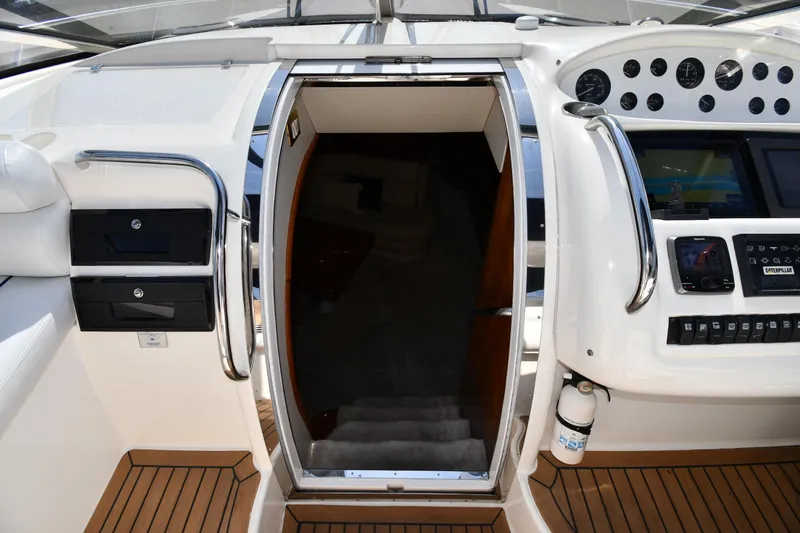 Slide: The Image of 1996 Sunseeker Camargue 51 yacht cockpit with stairs leading below deck. - 33