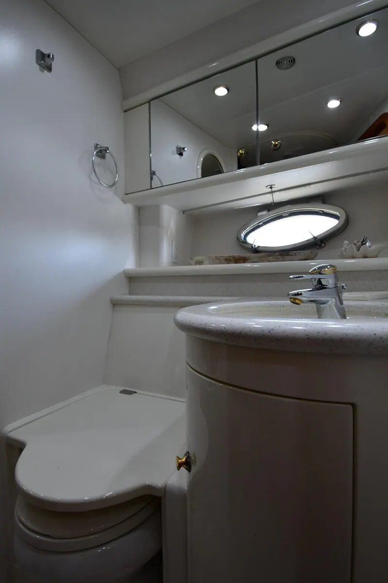 Slide: The Image of Bathroom interior of 1996 Sunseeker Camargue 51 yacht, featuring modern fixtures and mirrors. - 41