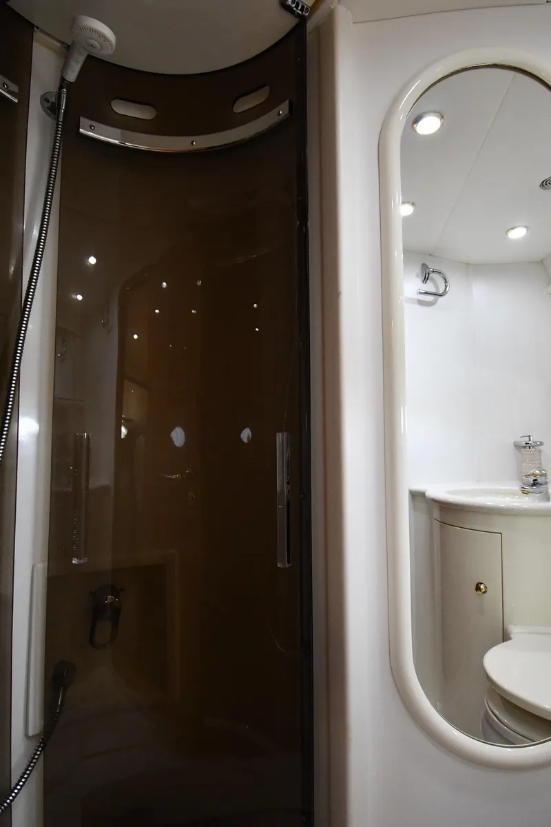 Slide: The Image of Bathroom interior of 1996 Sunseeker Camargue 51 yacht, featuring shower and vanity. - 42