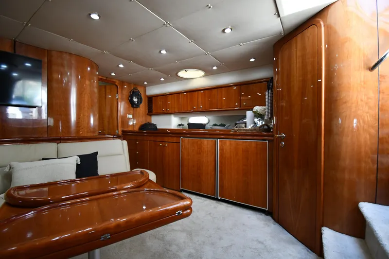 Slide: The Image of Luxurious interior of a 1996 Sunseeker Camargue 51 yacht with polished wood finishes. - 43