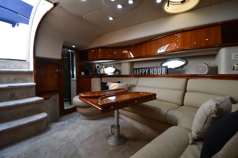 Slide: The Image of Luxurious interior of 1996 Sunseeker Camargue 51 yacht with elegant seating and wooden accents. - 47