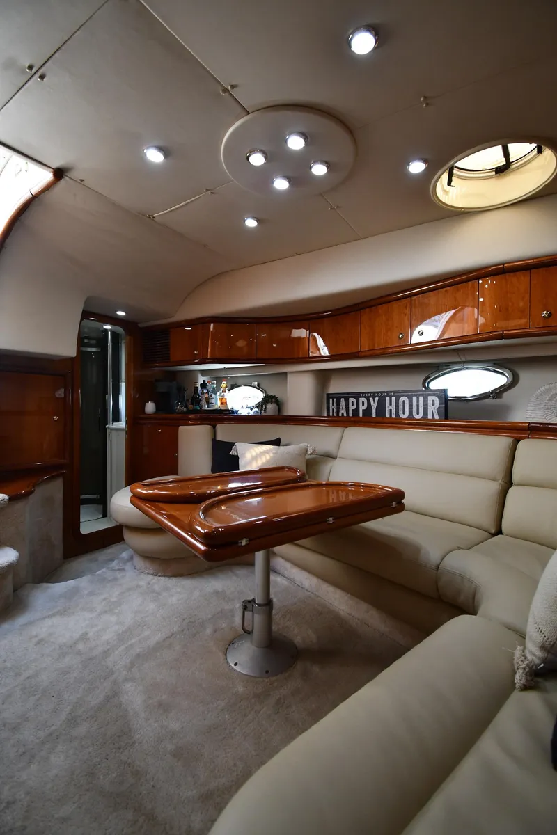 Slide: The Image of Luxurious interior of 1996 Sunseeker Camargue 51 yacht with elegant seating and wooden finishes. - 48