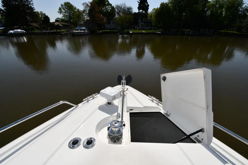 Slide: The Image of Bow view of 1996 Sunseeker Camargue 51 yacht on a calm river. - 6