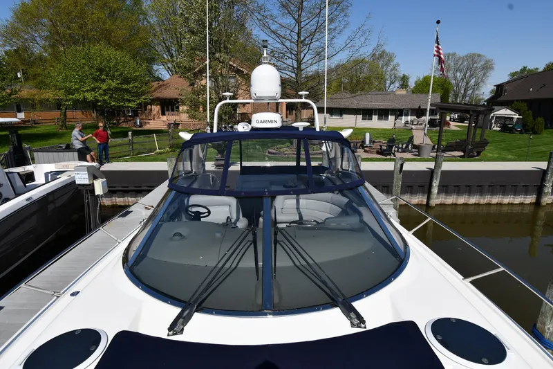 Slide: The Image of 1996 Sunseeker Camargue 51 yacht docked at a marina, front view. - 8