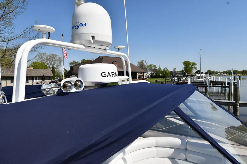 Slide: The Image of Sunseeker Camargue 51 yacht, 1996 model, with navigation equipment, docked at a marina. - 9