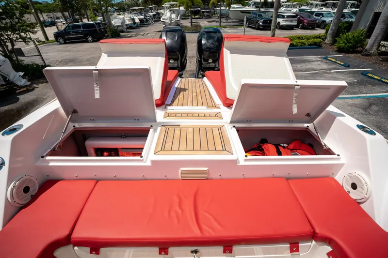 Slide: The Image of 2015 Pirelli 1100 boat with red seating and open storage compartments. - 27