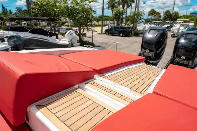 Slide: The Image of Red-cushioned deck of 2015 Pirelli 1100 boat with outboard motors in marina. - 30