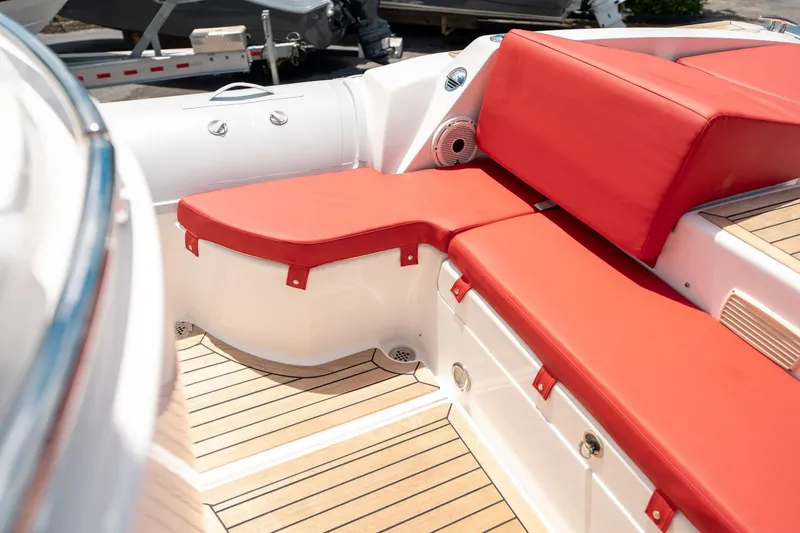 Slide: The Image of Red cushioned seating on a 2015 Pirelli 1100 boat with wooden deck. - 35