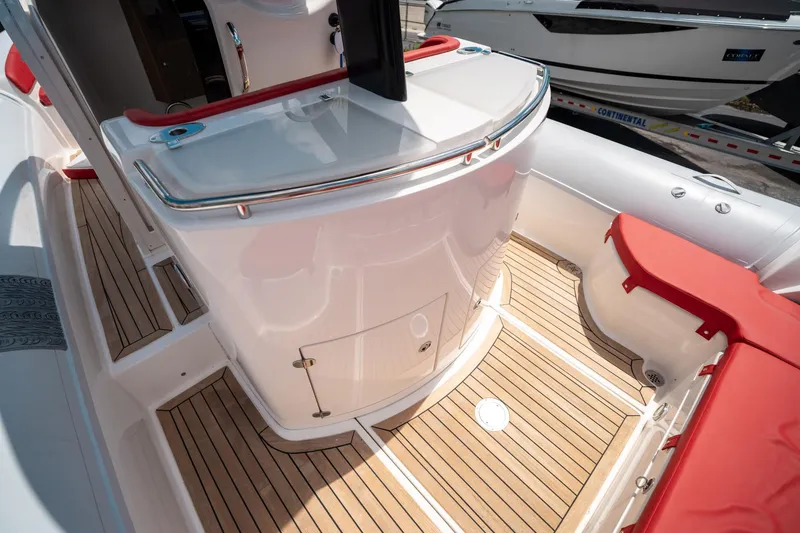 Slide: The Image of 2015 Pirelli 1100 boat interior with teak flooring and red seating. - 39