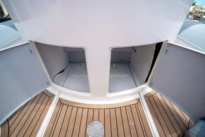 Slide: The Image of Open storage compartments on a 2015 Pirelli 1100 boat with wooden deck flooring. - 40