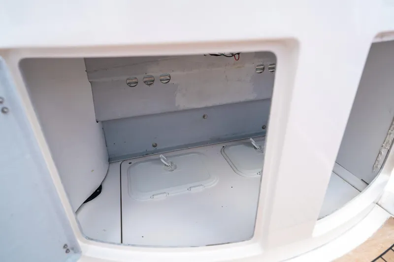 Slide: The Image of Storage compartment of a 2015 Pirelli 1100 boat, featuring secure latches. - 42