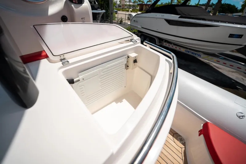 Slide: The Image of Open storage compartment on a 2015 Pirelli 1100 boat, with visible interior details. - 44