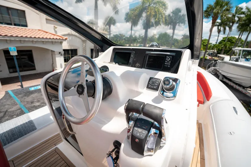Slide: The Image of Steering console of a 2015 Pirelli 1100 boat with modern controls and displays. - 48