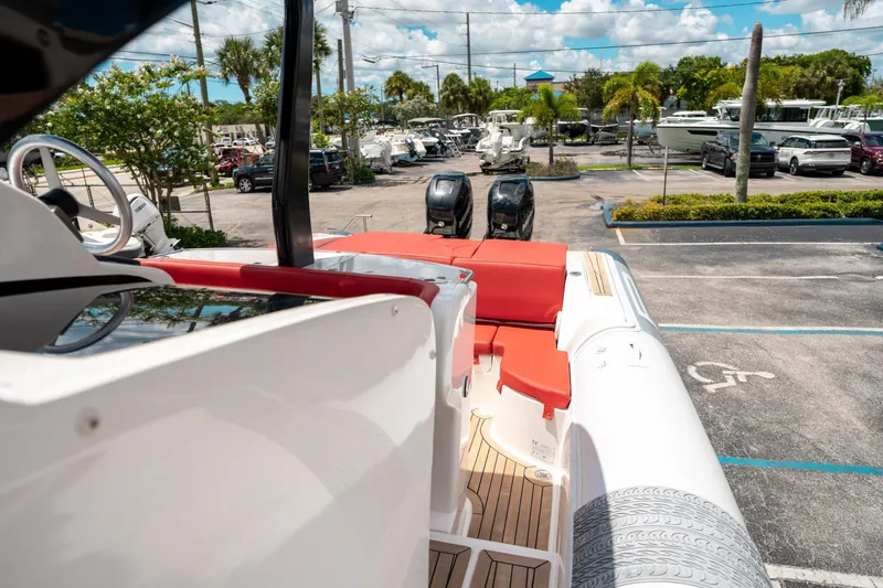 Slide: The Image of 2015 Pirelli 1100 boat with red seating, parked in a sunny marina. - 49