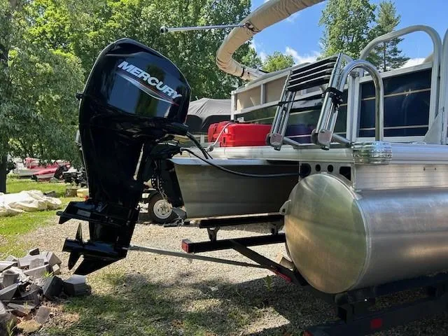 Slide: The Image of 2023 Sun Tracker Bass Buggy 16 XL Select pontoon boat with Mercury outboard motor. - 20