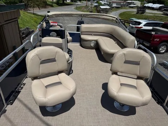 Slide: The Image of 2023 Sun Tracker Bass Buggy 16 XL Select pontoon boat with beige seating and spacious deck. - 3