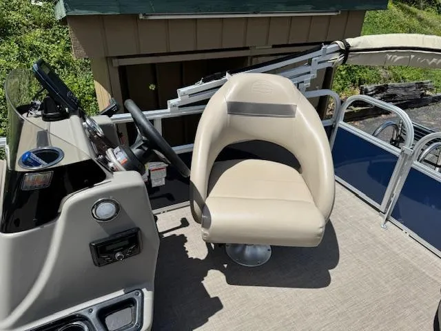 Slide: The Image of 2023 Sun Tracker Bass Buggy 16 XL Select boat interior with captain's chair and steering console. - 5